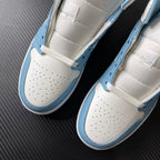 Jordan 1 Mid pair showing white perforated toe box and light blue side panel with lace strap