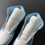 Jordan 1 Mid sneakers pair rear view with white padded collar and light blue trim