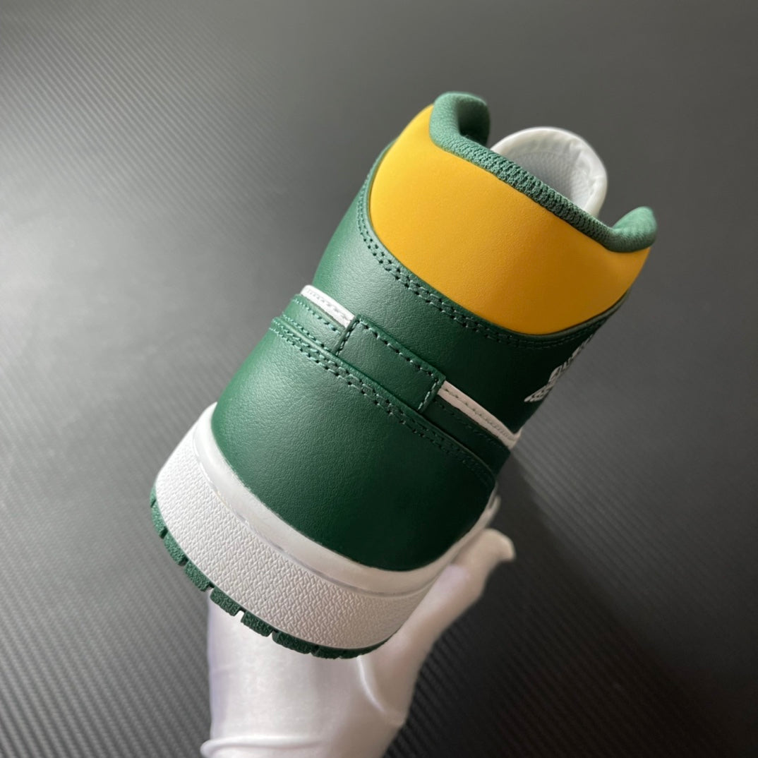 Mid-top sneakers heel view in green with white sole and yellow collar accent.