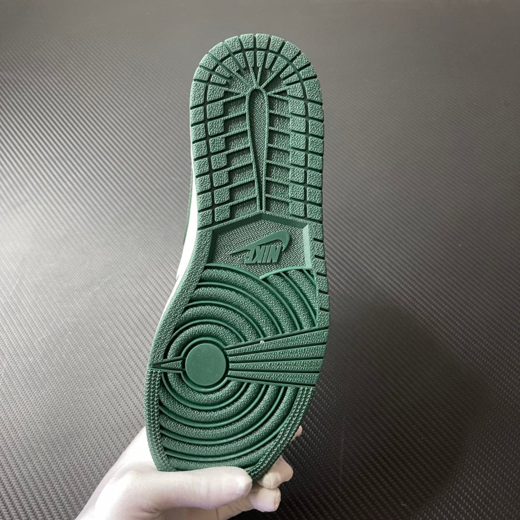Shoe outsole in green with grippy tread pattern and circular heel traction.