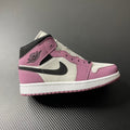 Mid-top sneakers in white, berry pink, and black with Air Jordan wing logo