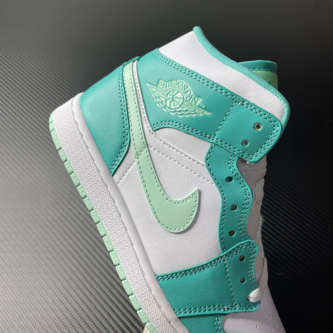 Mid-top sneaker in white and teal with lace eyelets and embossed wing logo