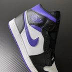 Air Jordan 1 Mid with purple collar overlay, black ankle strap, and white side panel