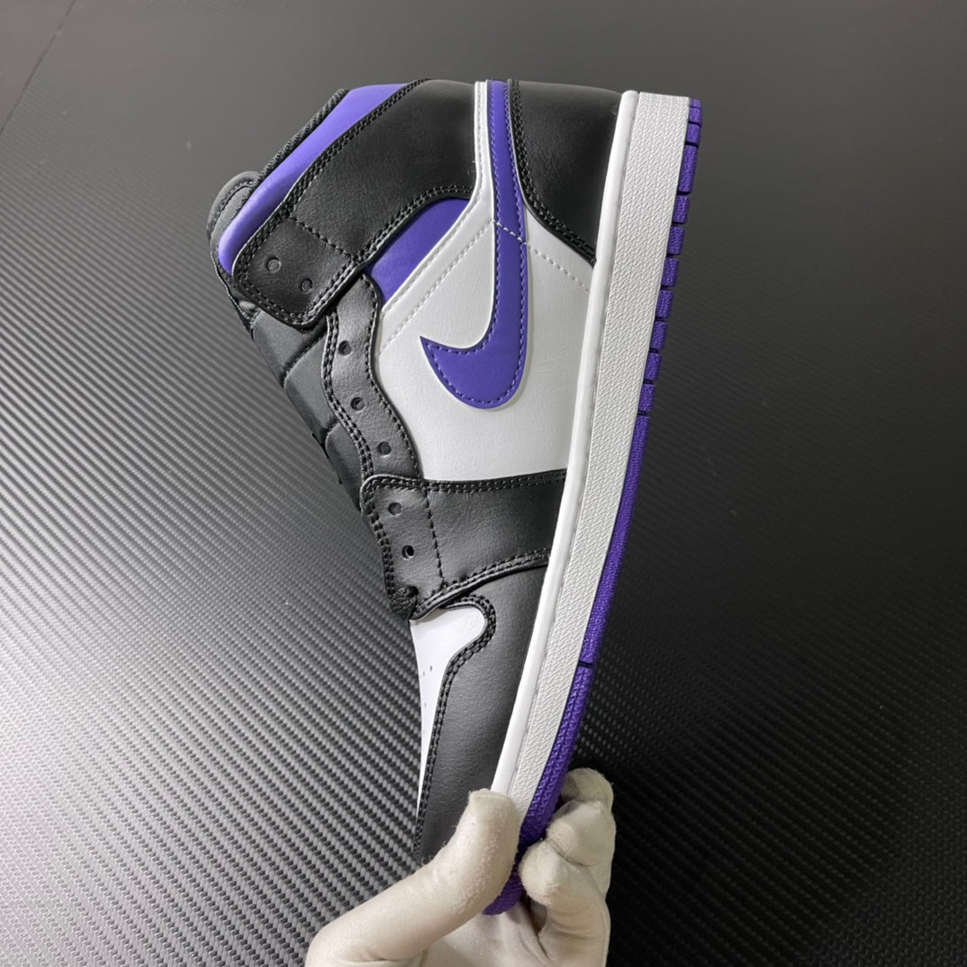 Air Jordan 1 Mid angled view with black upper, white side panel, and purple trim