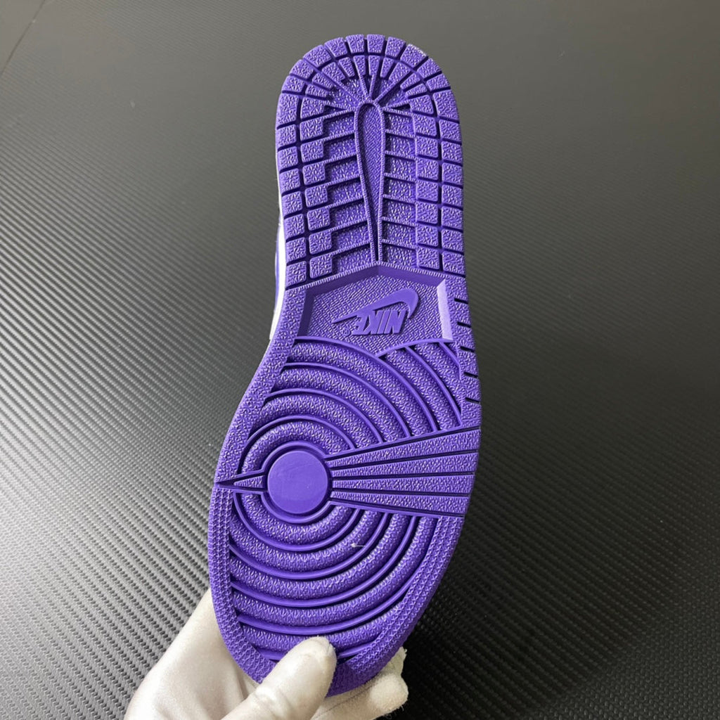 Air Jordan 1 Mid purple rubber outsole tread with pivot circle and traction grooves
