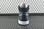 Back view of mid-top sneakers with dark teal heel, white midsole, and padded collar