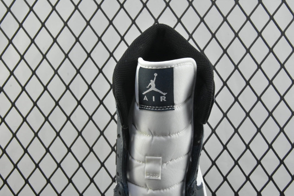 Inside collar view of mid-top sneakers with black lining and Air logo patch