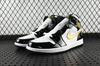 Air Jordan 1 Mid sneakers pair view, black patent and white leather with gold swoosh