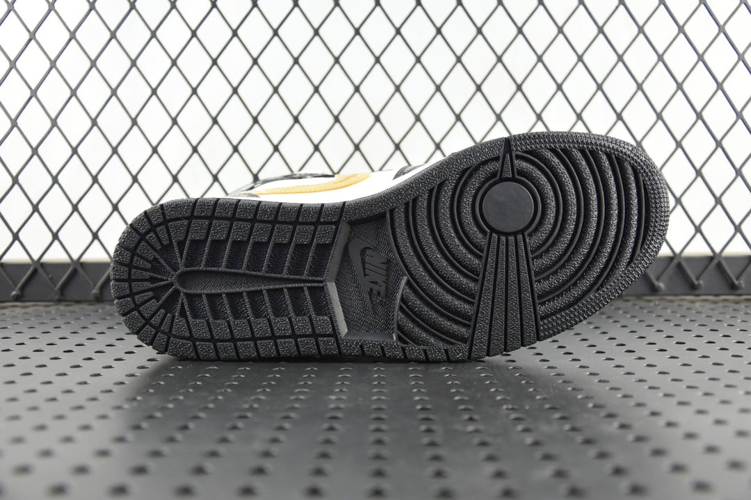 Air Jordan 1 Mid rubber outsole, black tread pattern with circular pivot zone