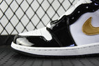 Air Jordan 1 Mid sneaker close-up, black glossy toe and white panel with gold swoosh