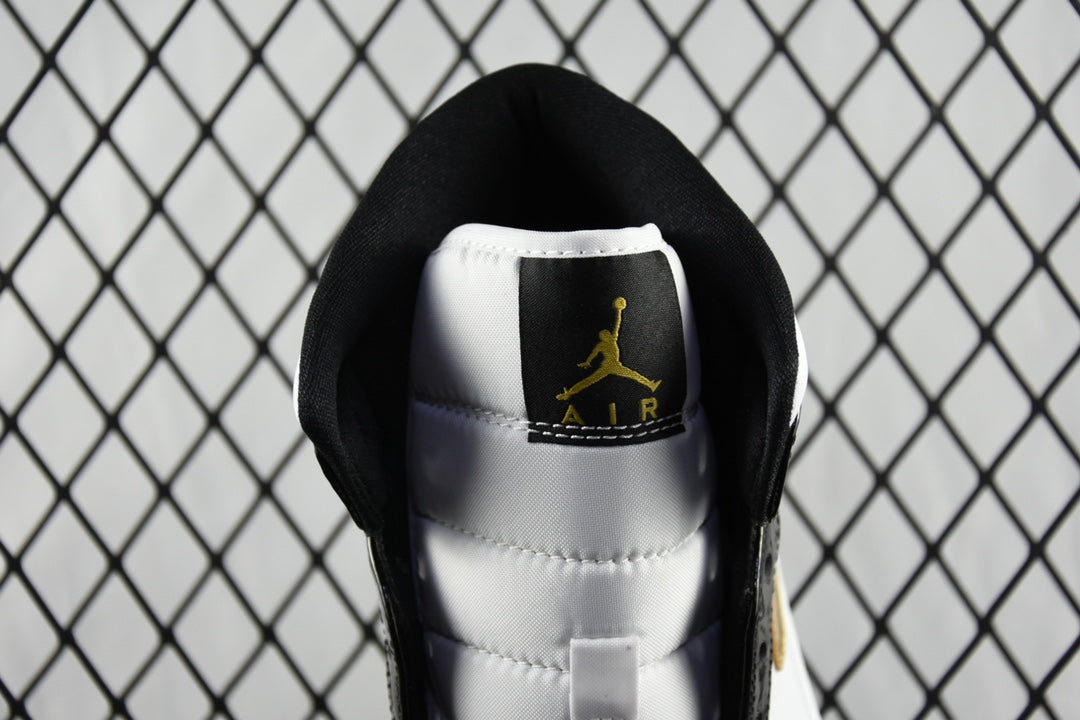 Air Jordan 1 Mid sneaker interior view, black sock liner with gold Air Jordan logo