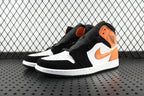 Air Jordan 1 Mid sneakers, black and orange with white side swoosh and midsole