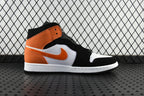 Air Jordan 1 Mid sneakers with orange collar, white panel, and black leather upper