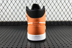 Air Jordan 1 Mid sneakers, rear view with black collar and orange heel panel