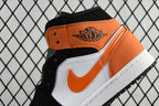 Air Jordan 1 Mid sneakers with orange ankle panel and black laces, side swoosh visible