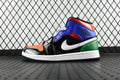 Mid-top sneaker with blue, black, orange, white, and green panels