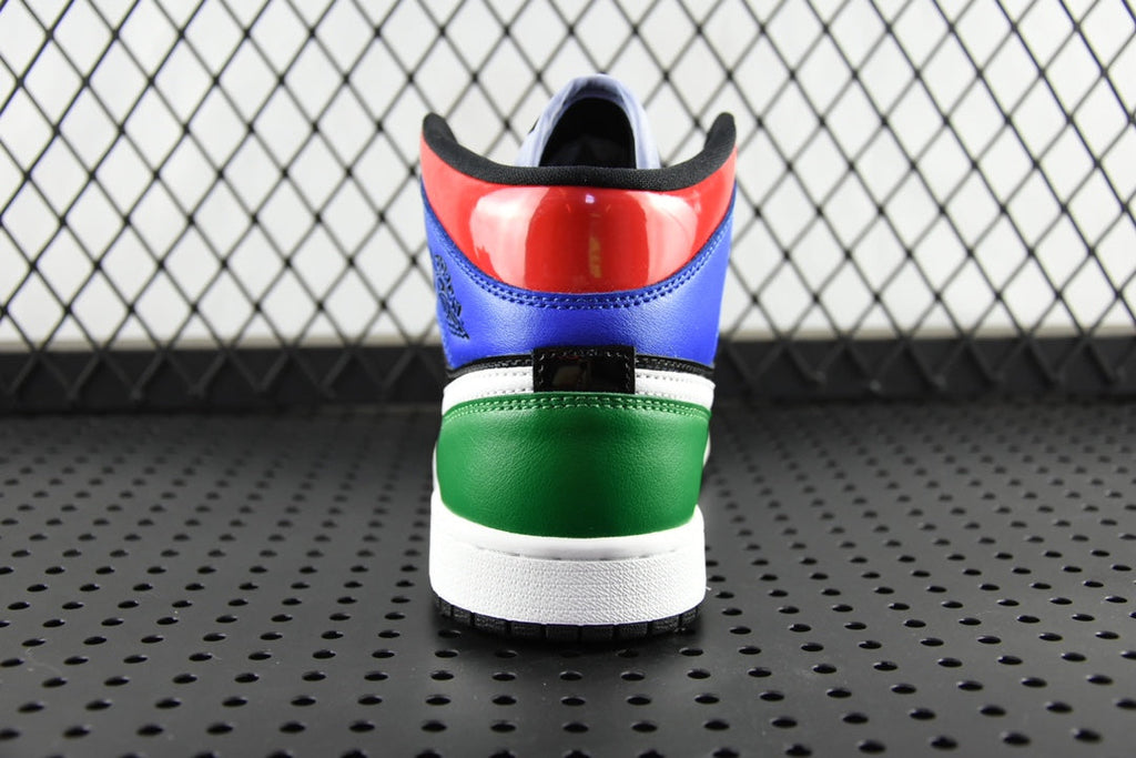 Mid-top sneaker heel with red patent panel, blue upper, black, and green band