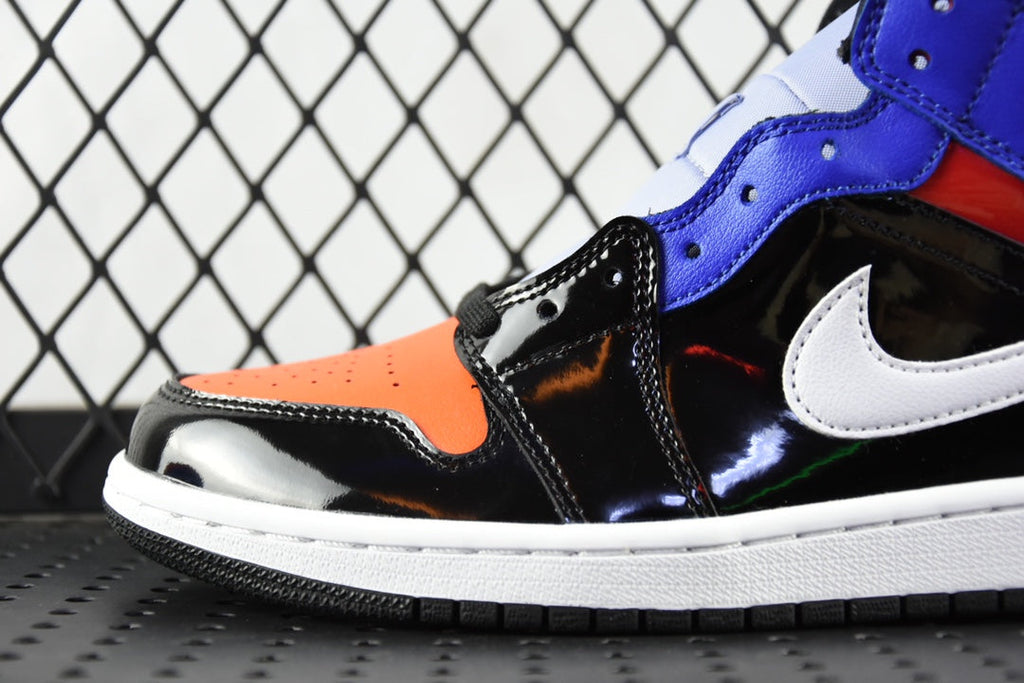 Mid-top sneaker side view with glossy black, orange toe, blue collar, and white swoosh