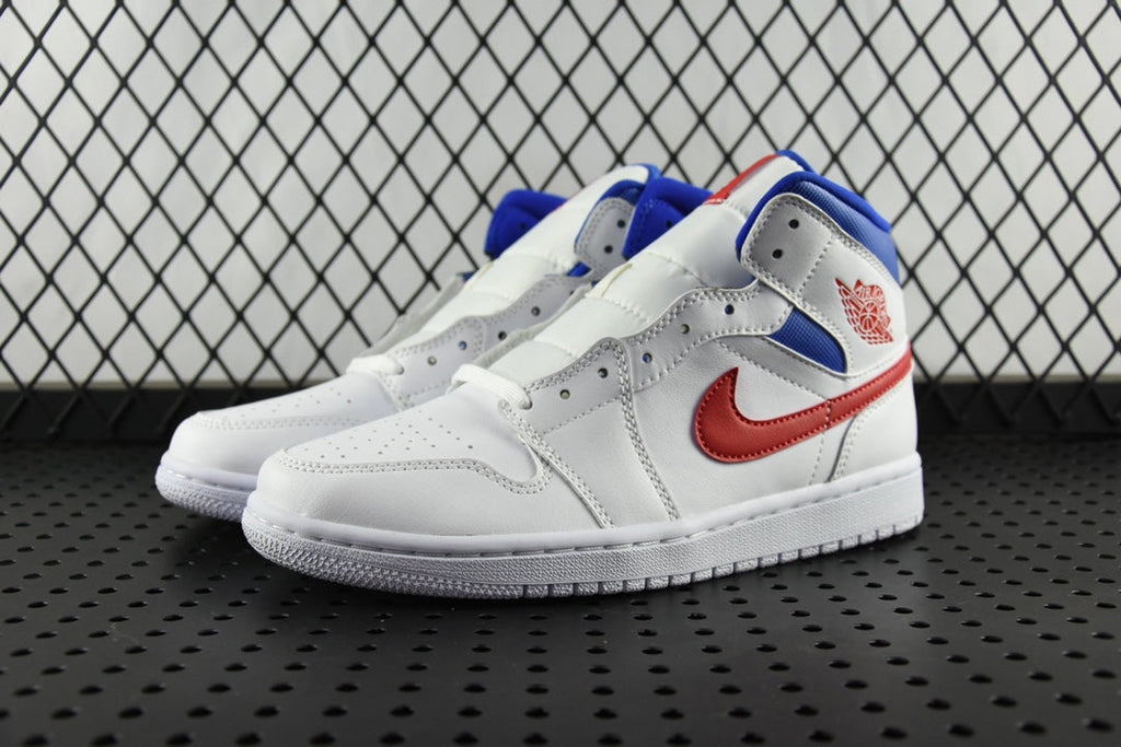 White mid-top sneakers with blue collar, red swoosh, and red accent stitching.