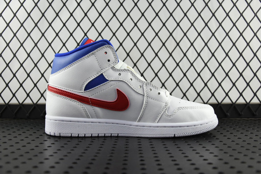 White mid-top sneaker with blue collar, red swoosh, and white laces.