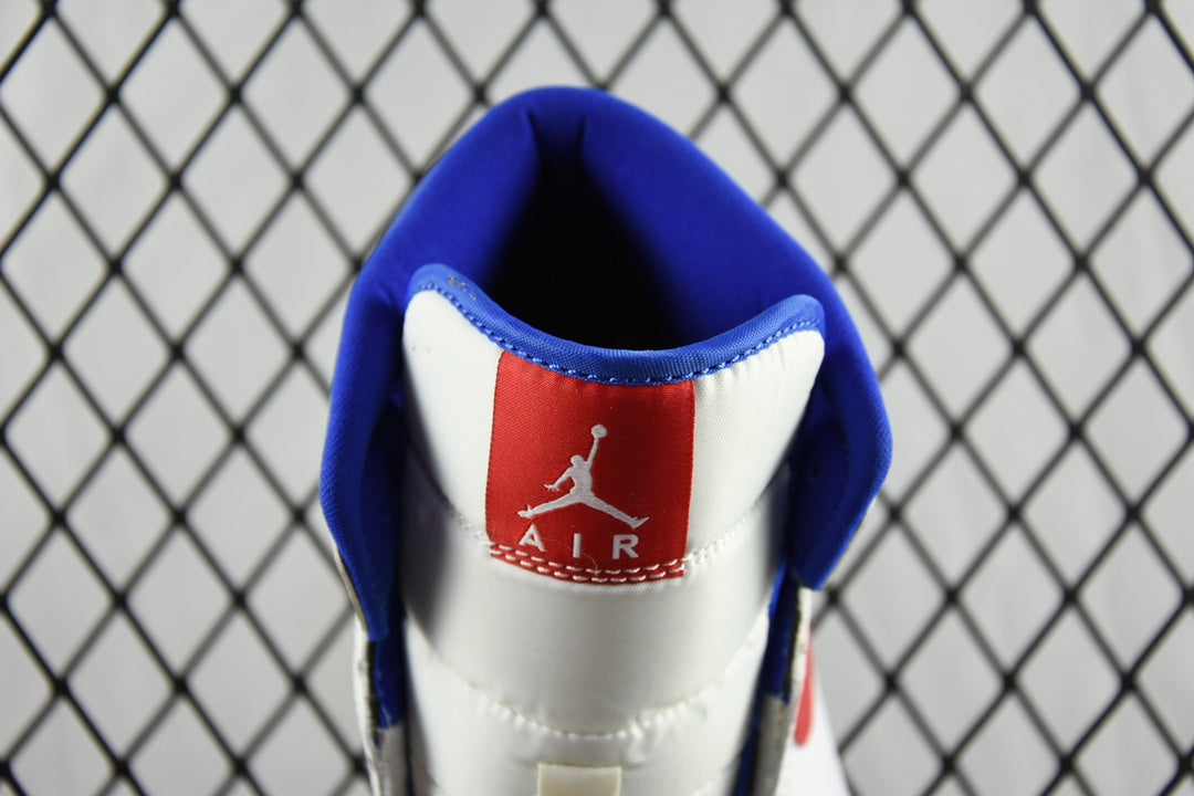 White sneaker heel with blue collar lining and red Air logo patch.