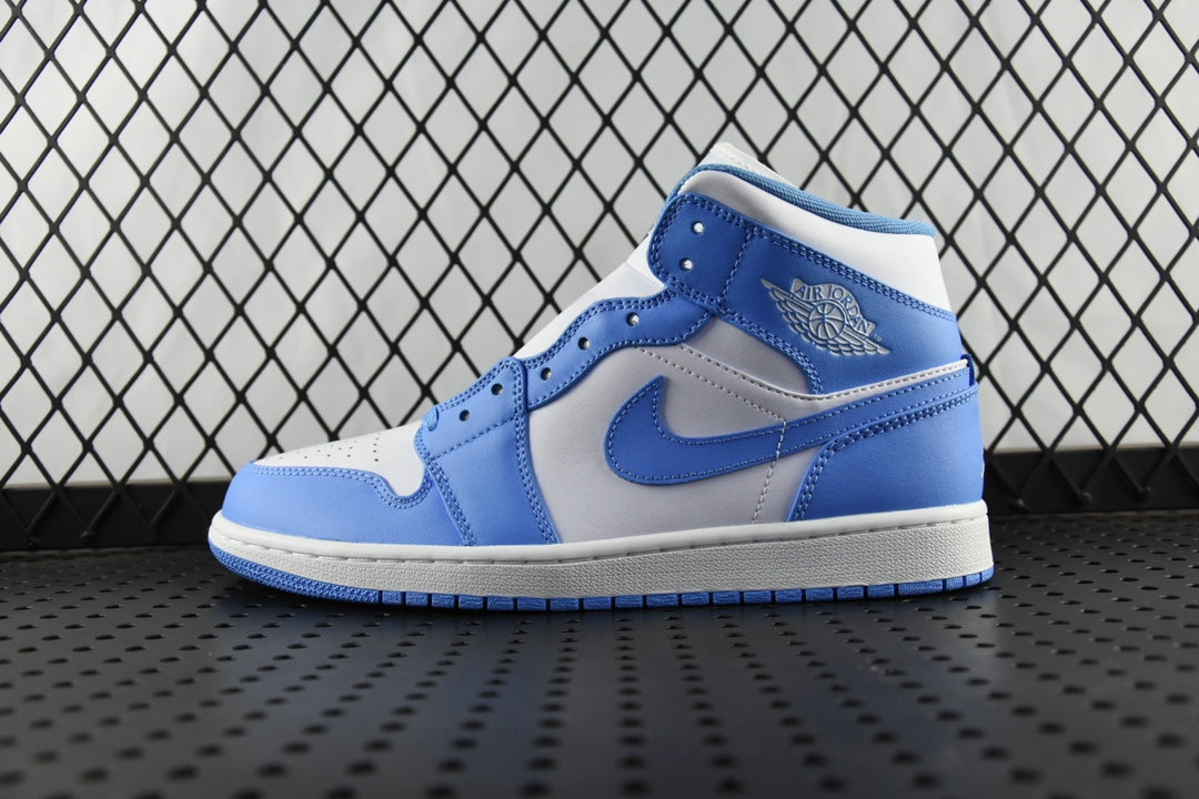 Mid-top basketball shoe with white leather panels and light blue overlays