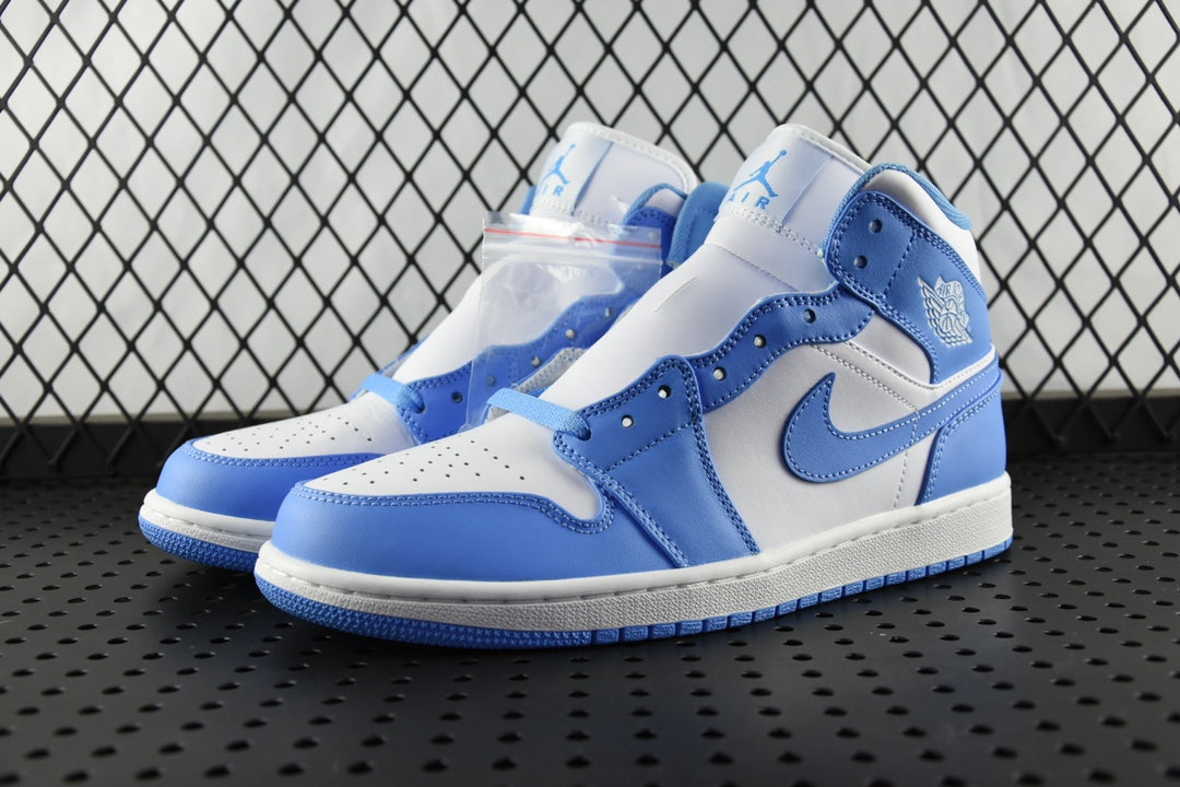 Pair of mid-top basketball shoes in white and light blue with blue swoosh