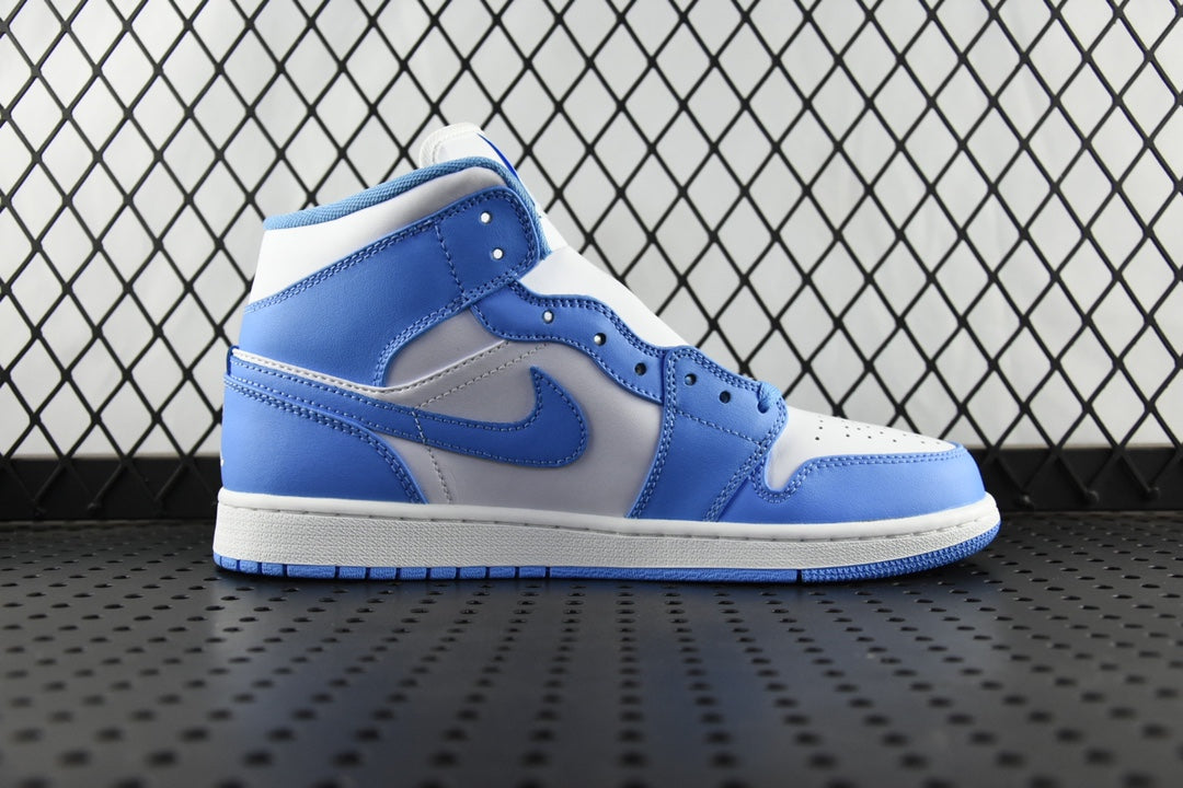Mid-top basketball shoe in white and light blue with perforated toe box