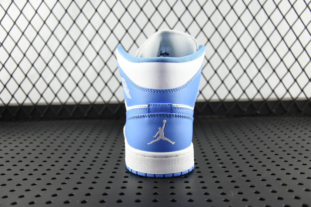 Back view of mid-top basketball shoe in white with light blue ankle collar