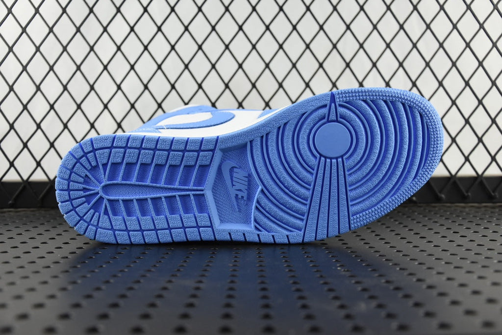 Rubber outsole of a mid-top basketball shoe in light blue with tread pattern