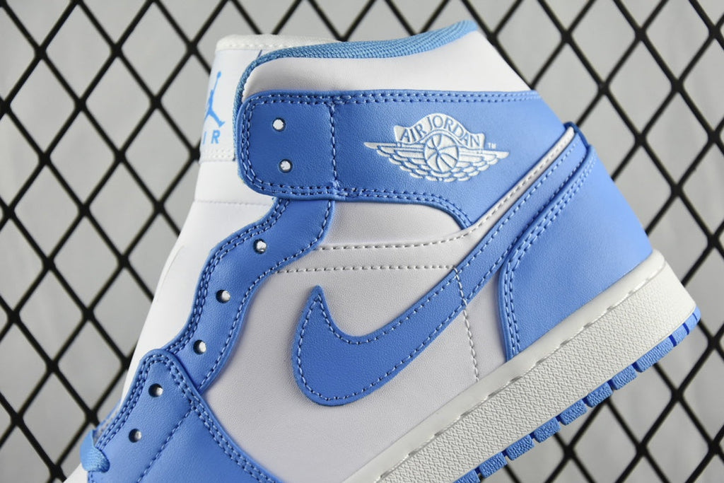 Close-up of mid-top basketball shoe collar with light blue and white stitching