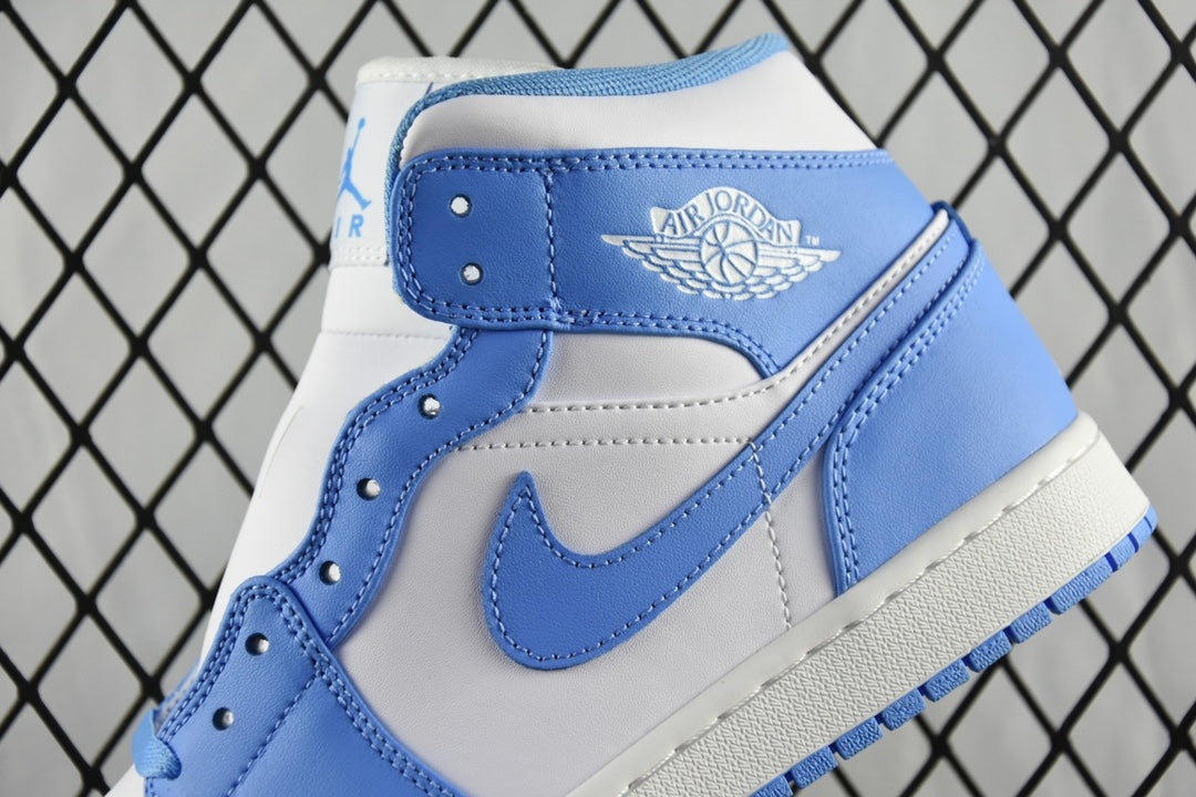 Close-up of mid-top basketball shoe collar with light blue and white stitching