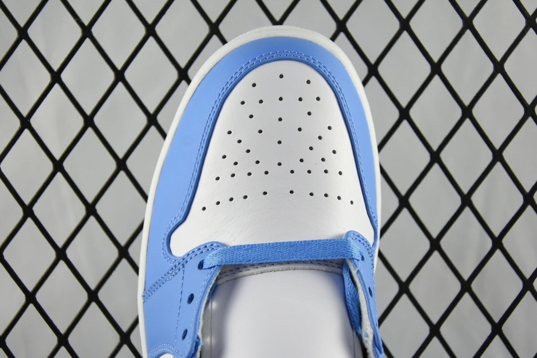 Front view of mid-top basketball shoe with white toe panel and blue laces