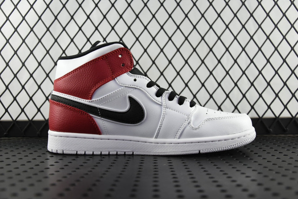Mid-top sneaker side view with red quarter panels, black swoosh on white leather