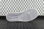 Sneaker outsole view with gray tread pattern