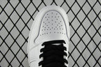 White leather sneaker toe with perforations and black lace
