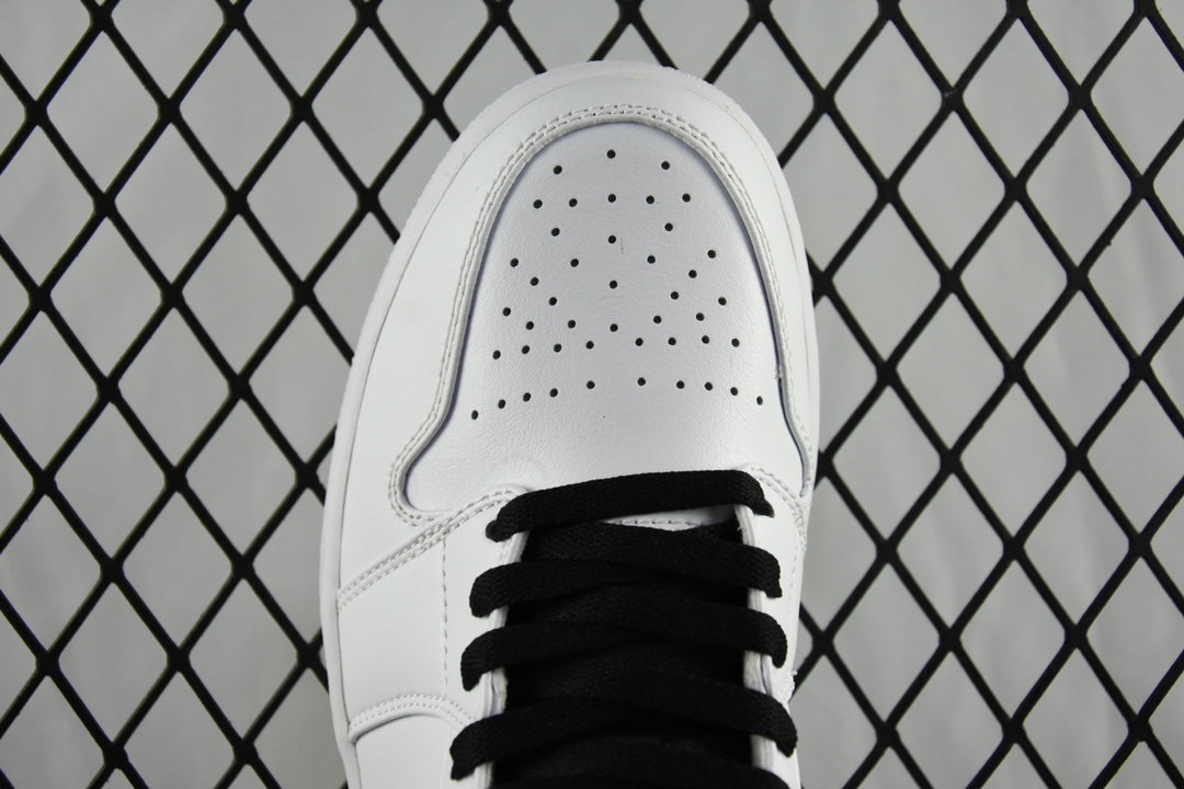 White leather sneaker toe with perforations and black lace