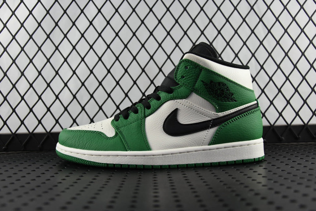 Air Jordan 1 Mid green and white high-top sneaker with black swoosh