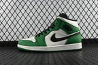 Air Jordan 1 Mid green and white high-top sneaker with black swoosh