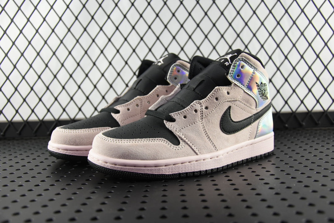 Air Jordan 1 Mid sneakers pair, light gray suede uppers with black swoosh and iridescent panels