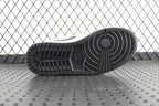 Air Jordan 1 Mid outsole, textured black rubber tread bottom view