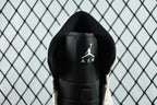 Air Jordan 1 Mid heel close-up, black backing with Air logo and AIR text