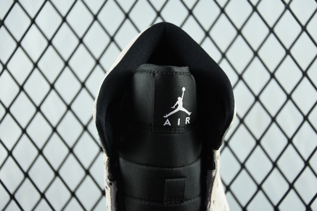 Air Jordan 1 Mid heel close-up, black backing with Air logo and AIR text