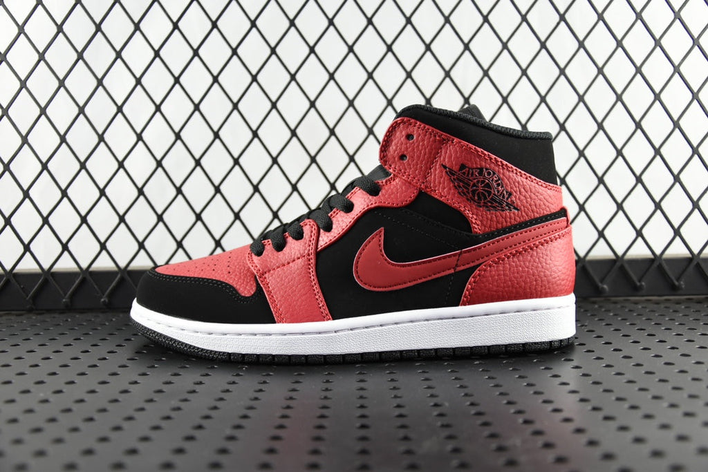 Mid-top leather sneaker with red and black panels, black laces, white sole