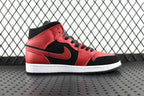 Mid-top leather sneaker in red and black with swoosh side panel and black laces