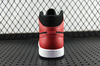 Heel view of red and black mid-top sneaker with white rubber sole