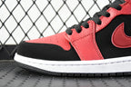 Side view of red and black mid-top sneaker with black swoosh and white midsole