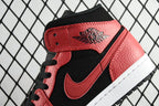 Red and black mid-top sneaker with logo tongue patch and black lace-up closure