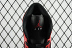 Inside heel view of black insole with red Jumpman logo on mid-top sneaker