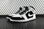 Black and white mid-top sneakers, perforated toe, lace-up with black laces